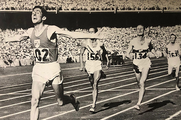 runner Ron Delany on the track winning Olympic Gold in 1956