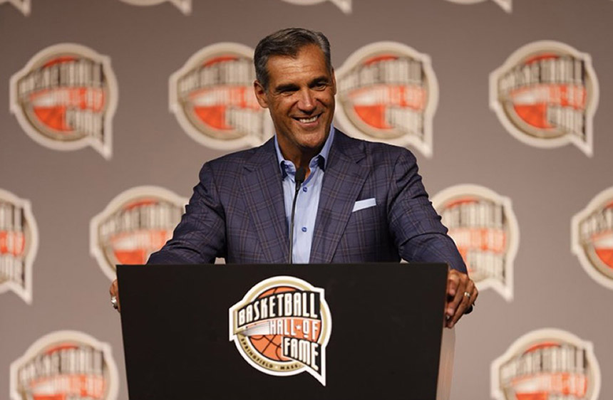 Jay Wright standing at a podium during his induction into the Basketball Hall of Fame