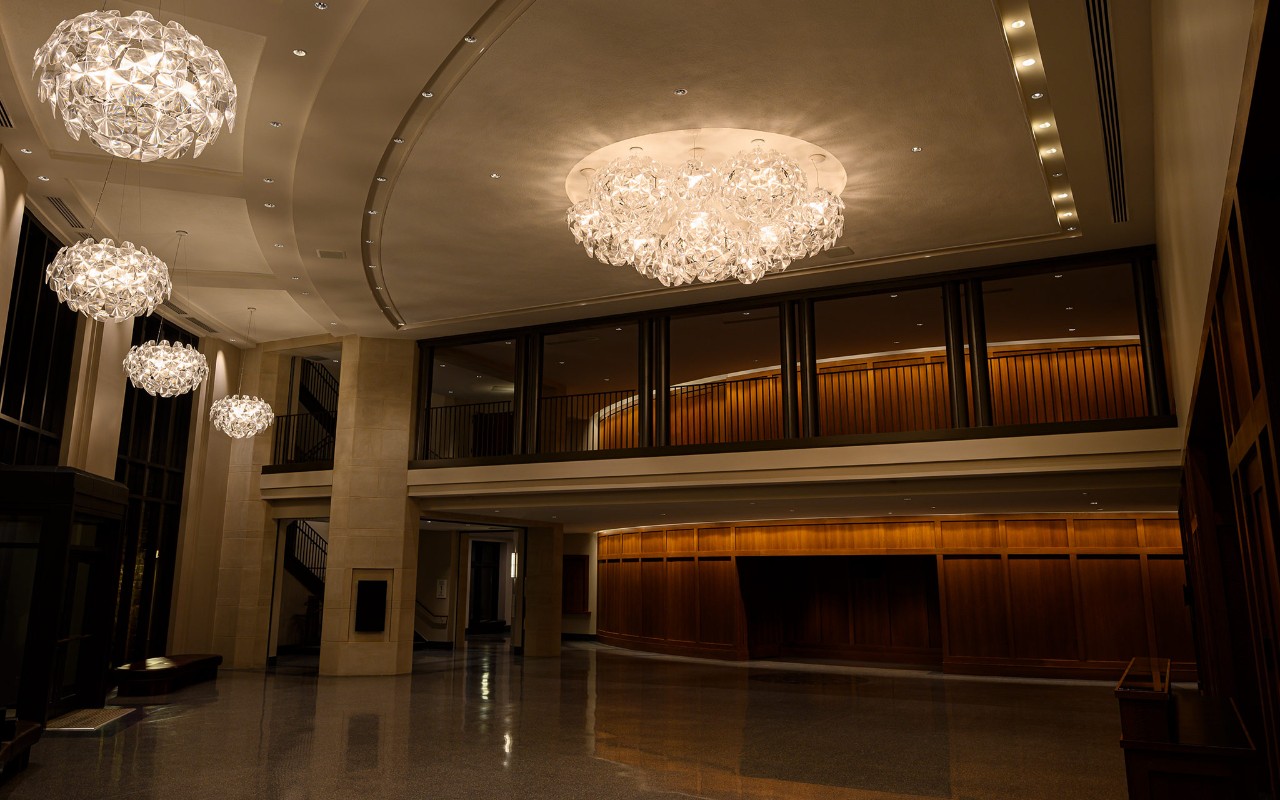 five crystal chandeliers in the empty Mullen Center lobby