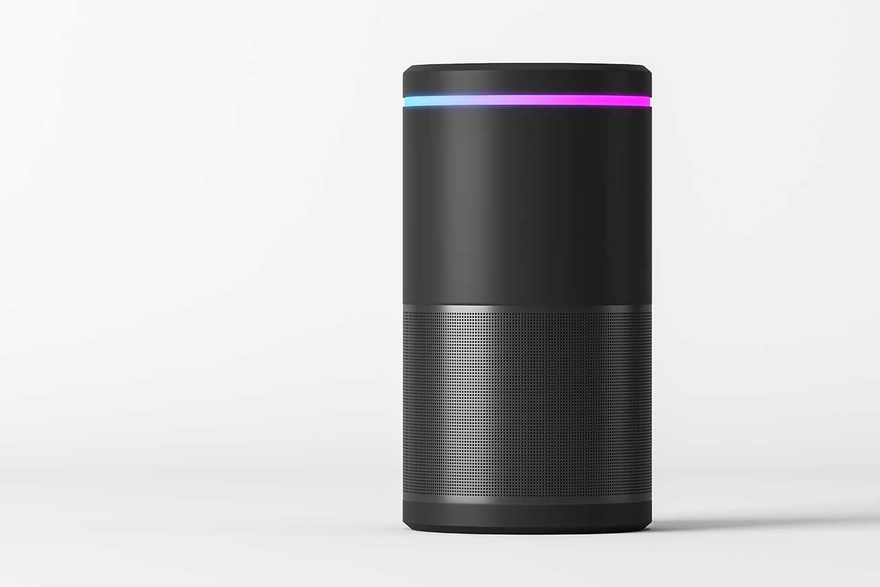 a black Amazon Echo with a light going from blue to purple