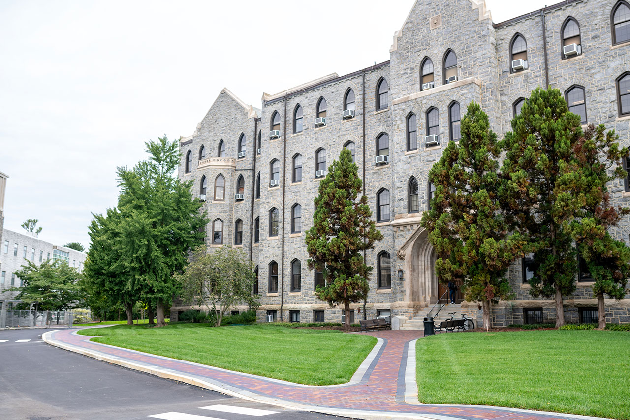 a brick paver walkway leads to the front of Tolentine Hall on Villanova's campus