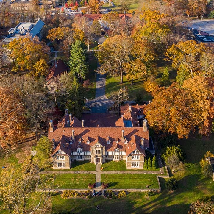 Aerial view of Cabrini’s campus in the fall, with colorful autumn foliage surrounding the buildings.