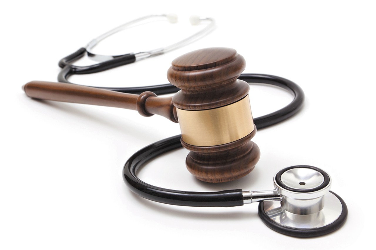 a stethoscope intersecting with a gavel