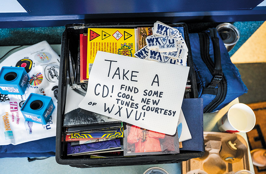 a note indicates that CDs and stickers in a small crate are free to take