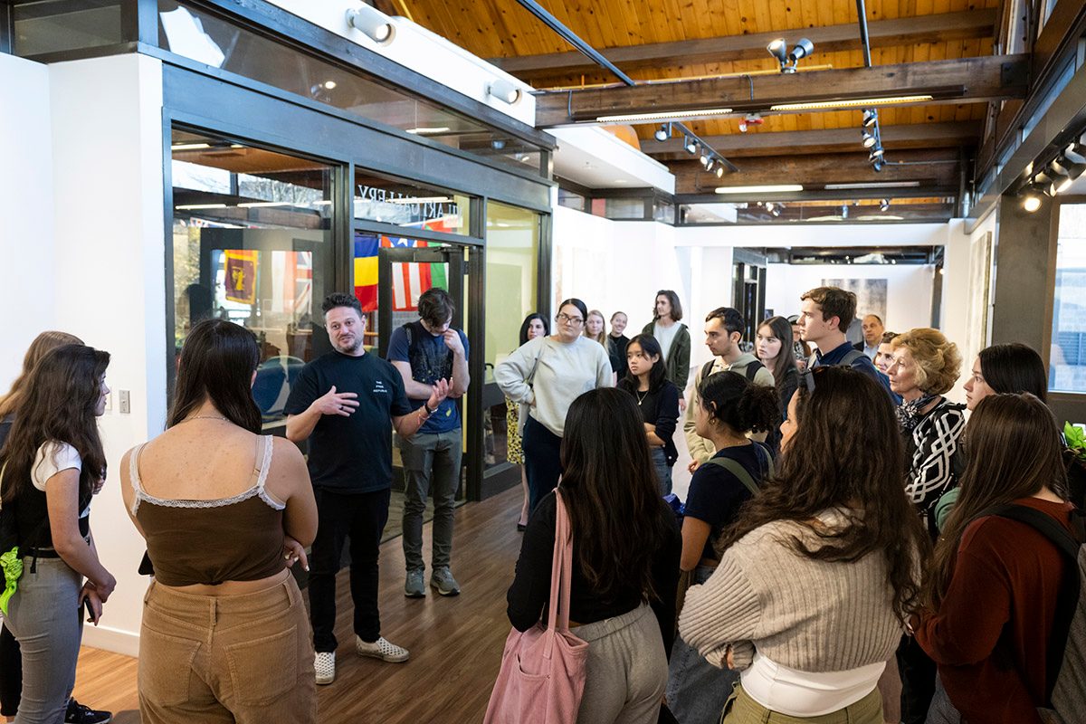 Cole Sternberg giving a talk about artwork in the Art Gallery