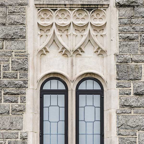 double windows in an ornate stone building