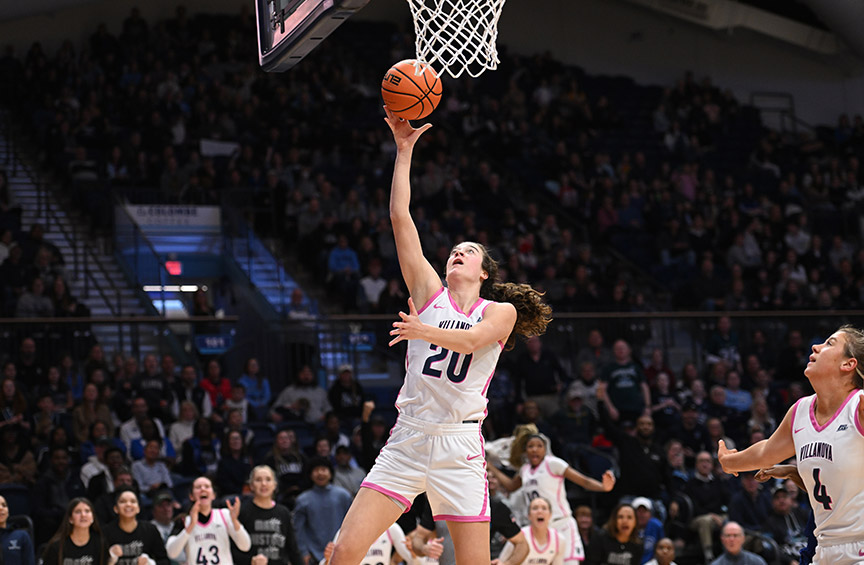 Women's Basketball team captain Maddy Siegrist in action with the ball