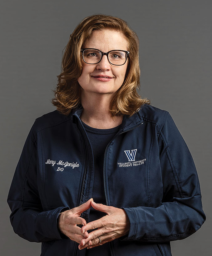 A portrait of Mary McGonigle who's wearing a dark blue Villanova lab coat