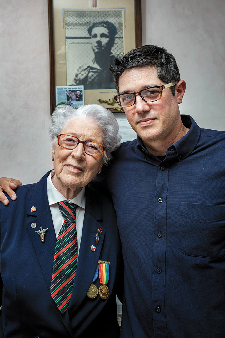 Director Anthony Giacchino with his arm around French resistance fighter Colette Marin-Catherine