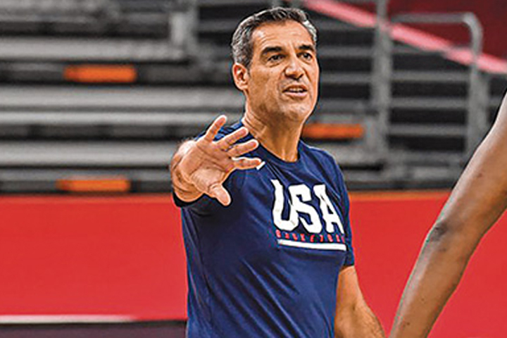 Villanova men's basketball head coach Jay Wright wearing a blue USA basketball t-shirt
