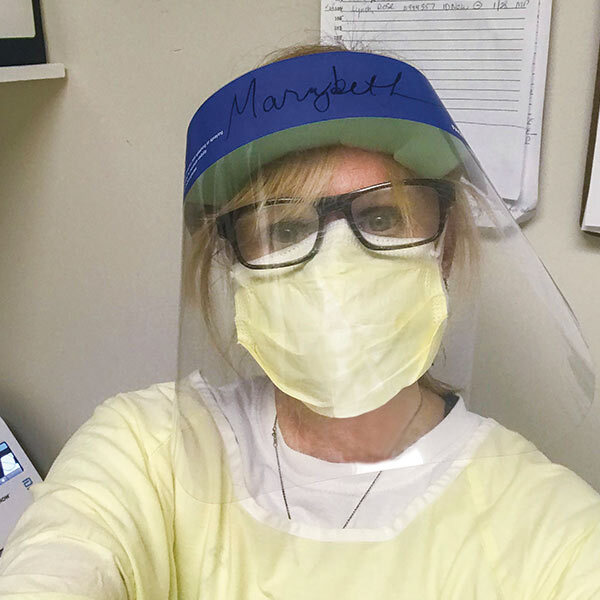 a female nurse wearing PPE