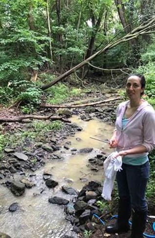 Graduate Student Emily Carambelas at the headwaters of Chrome Run