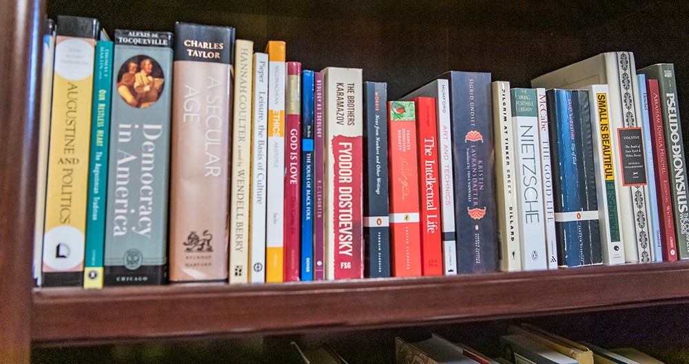 Books lined up on a bookshelf