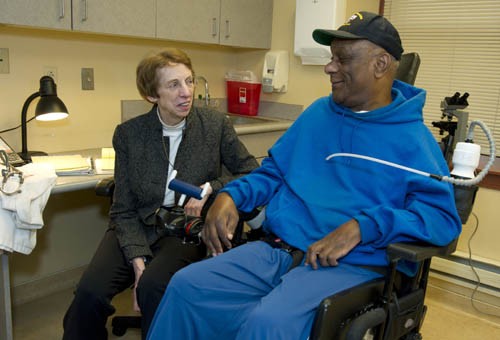 Dr. Smeltzer with patient in wheelchair